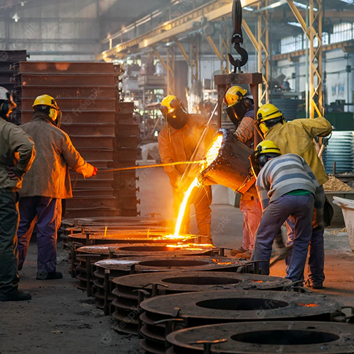 molten metal being port in castings by factory workers