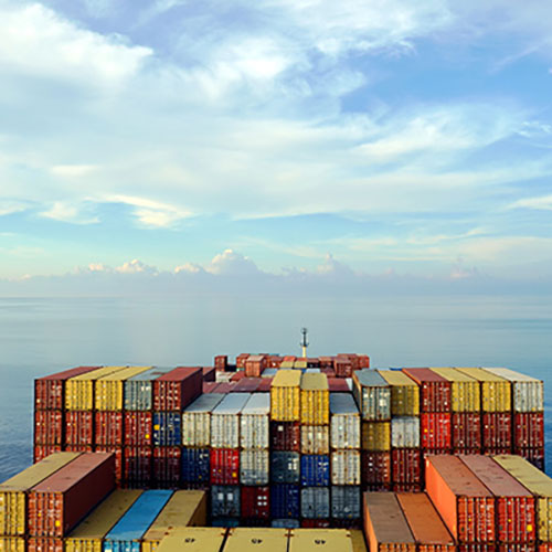 images of shipping containers in large ship in sea